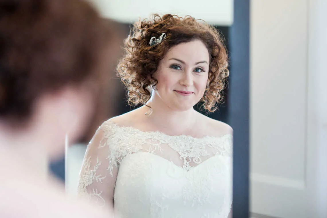 Bridal portrait looking into mirror