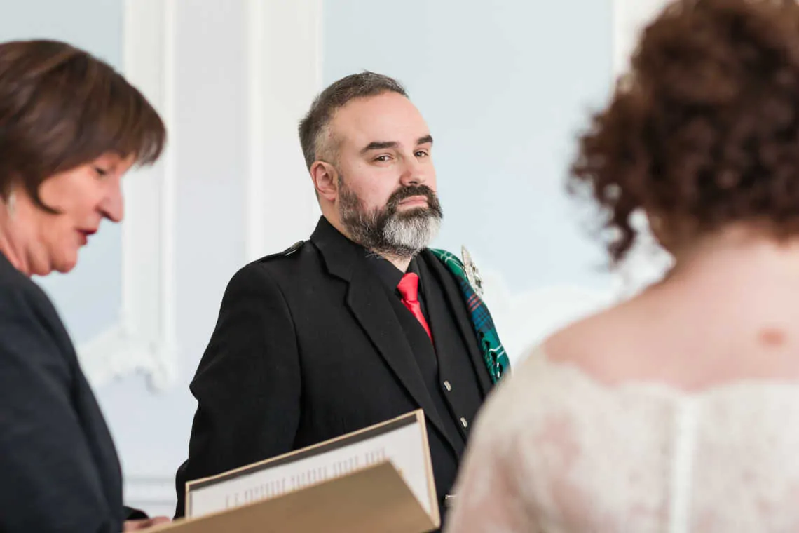 Groom looking at the bride at marriage during humanist marriage ceremony