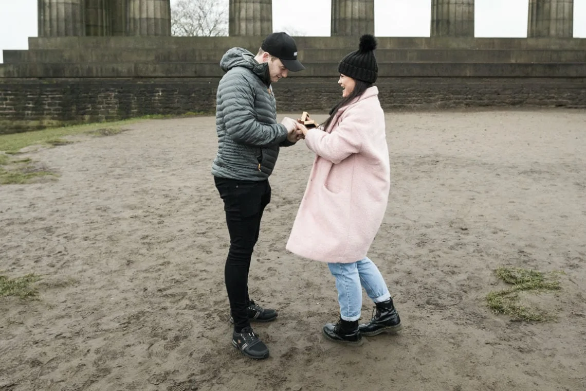 Jake puts engagement ring on his fiancé's finger