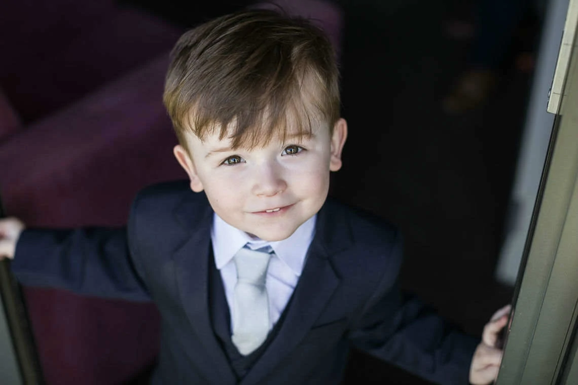 little boy wearing suit