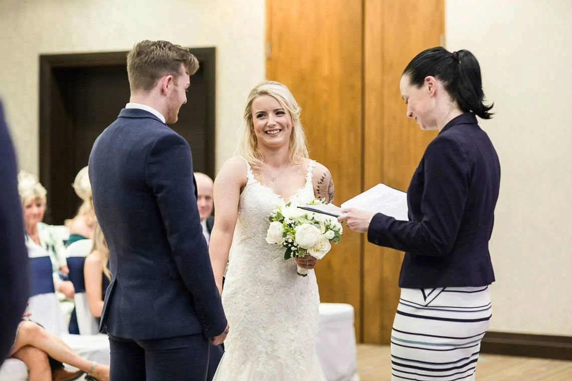 bride smiling at groom during humanist wedding ceremony
