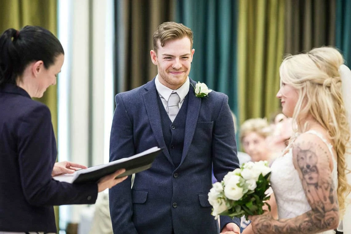 groom smiling during humanist wedding ceremony
