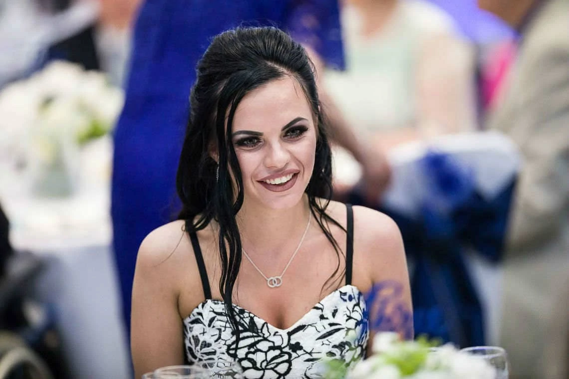 wedding guest smiling at evening reception