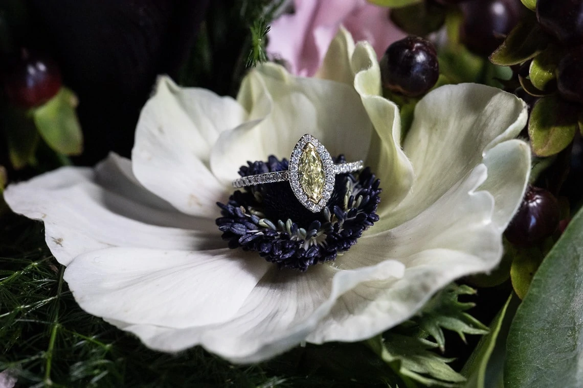 engagement ring sat inside a flower