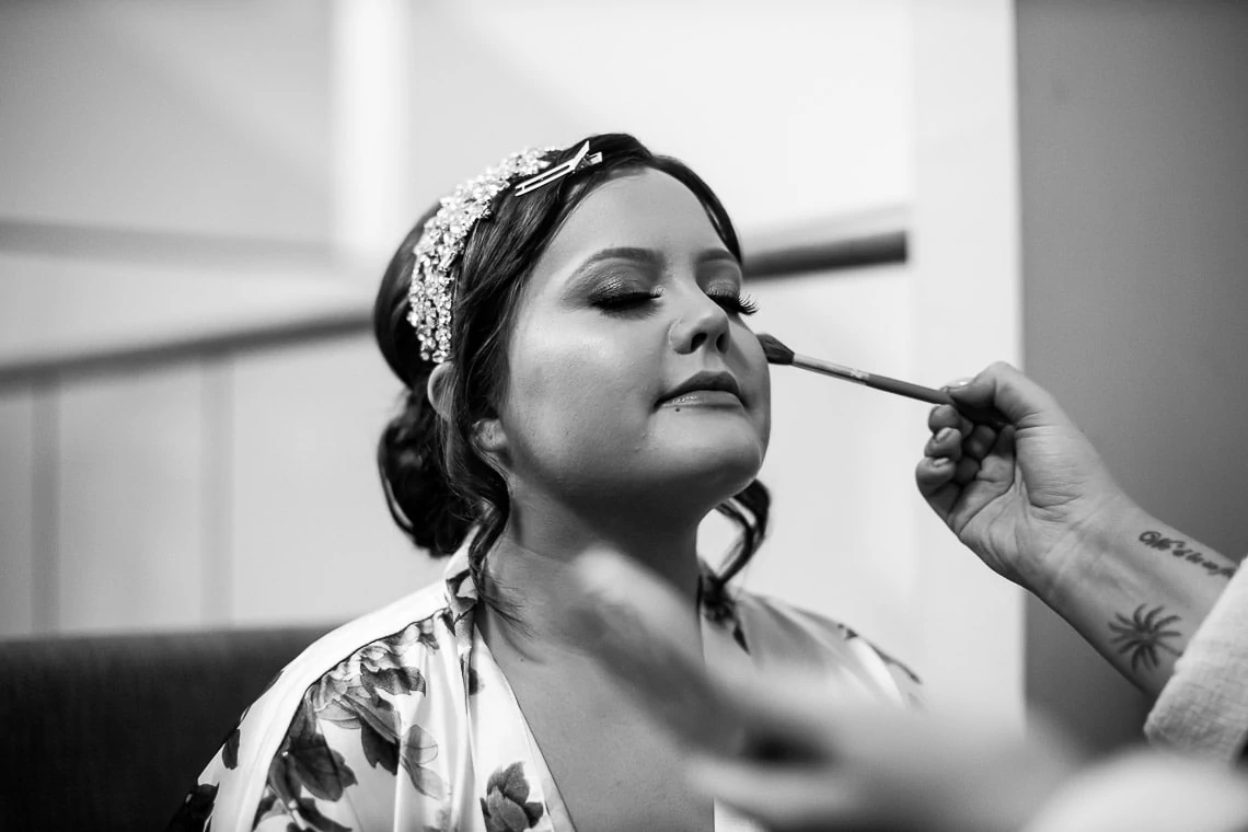 bride's makeup being applied