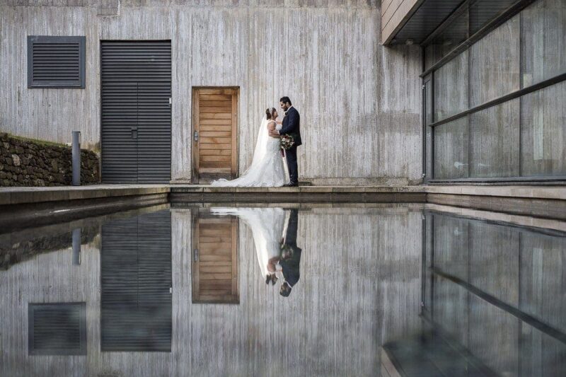 bride and groom beside the spa pool