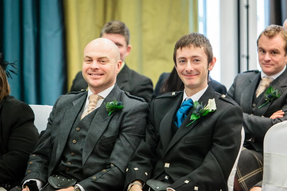 groom and best man seated before the ceremony
