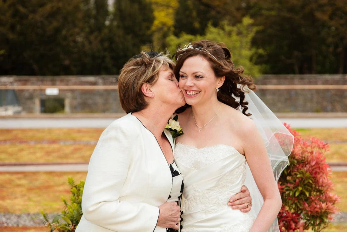 bride kissed by her mother