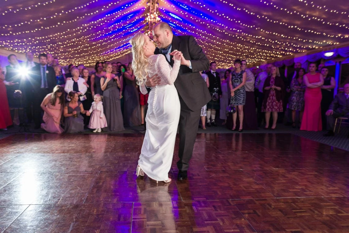 Pavilion newlyweds' first dance embrace