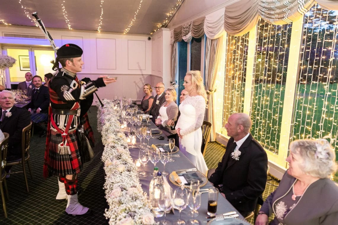 Pavilion top table piper toast to the newlyweds