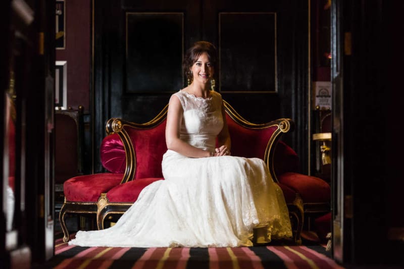 wedding photographer questions - bride sitting at Prestonfield House