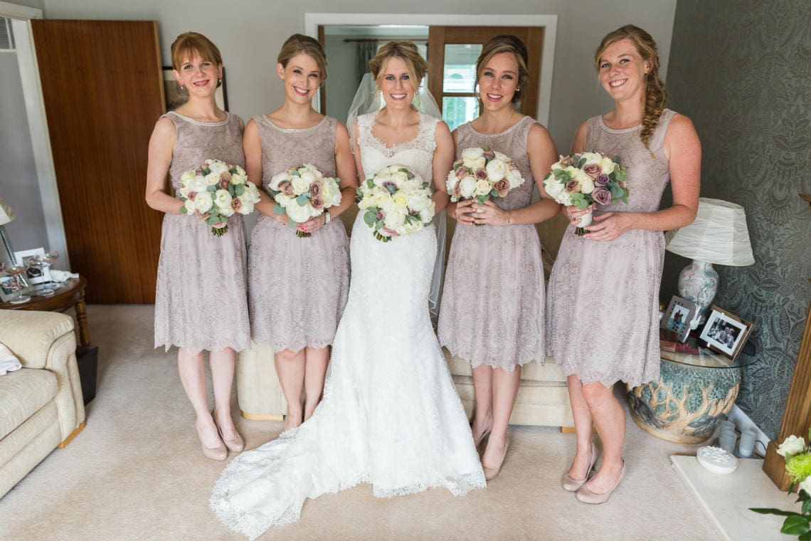 bride and bridesmaids holding their bouquets