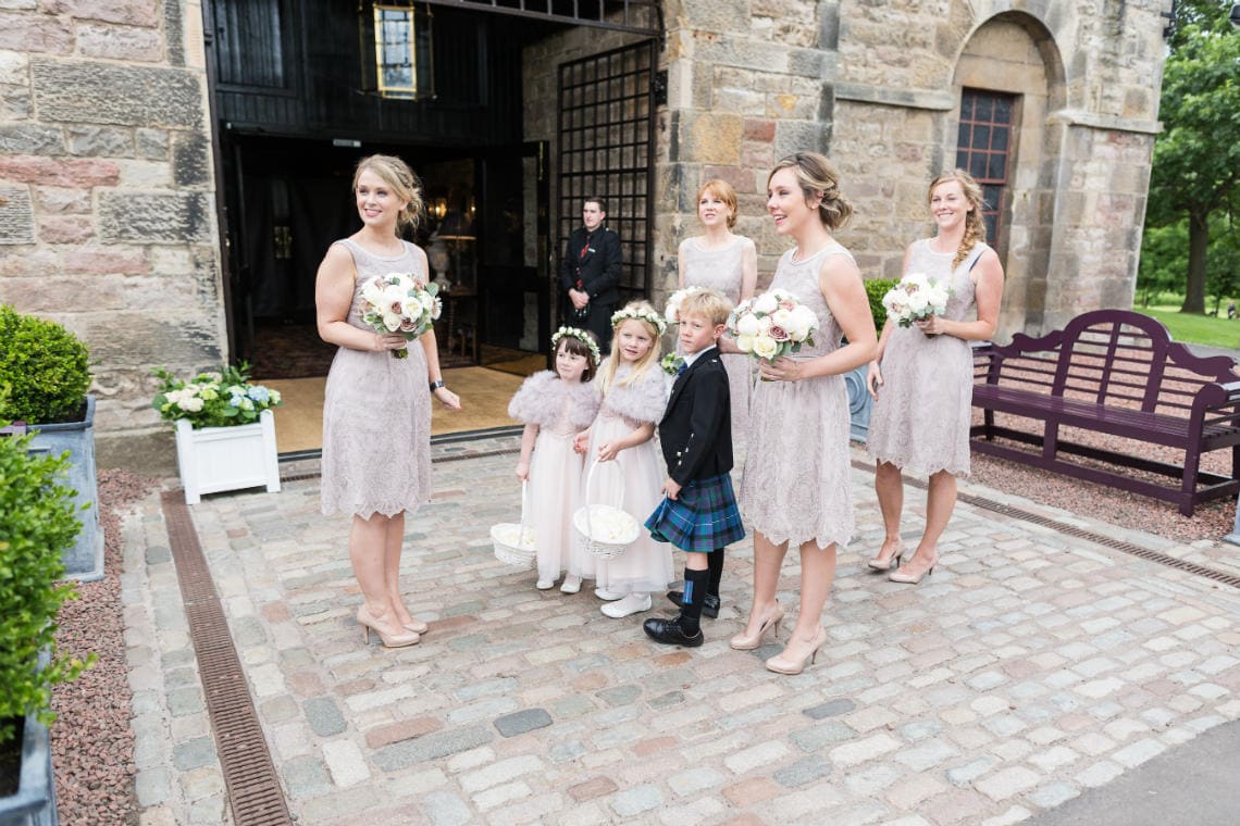 bridesmaids waiting outside the Stables Ballroom for the arrival of the bride