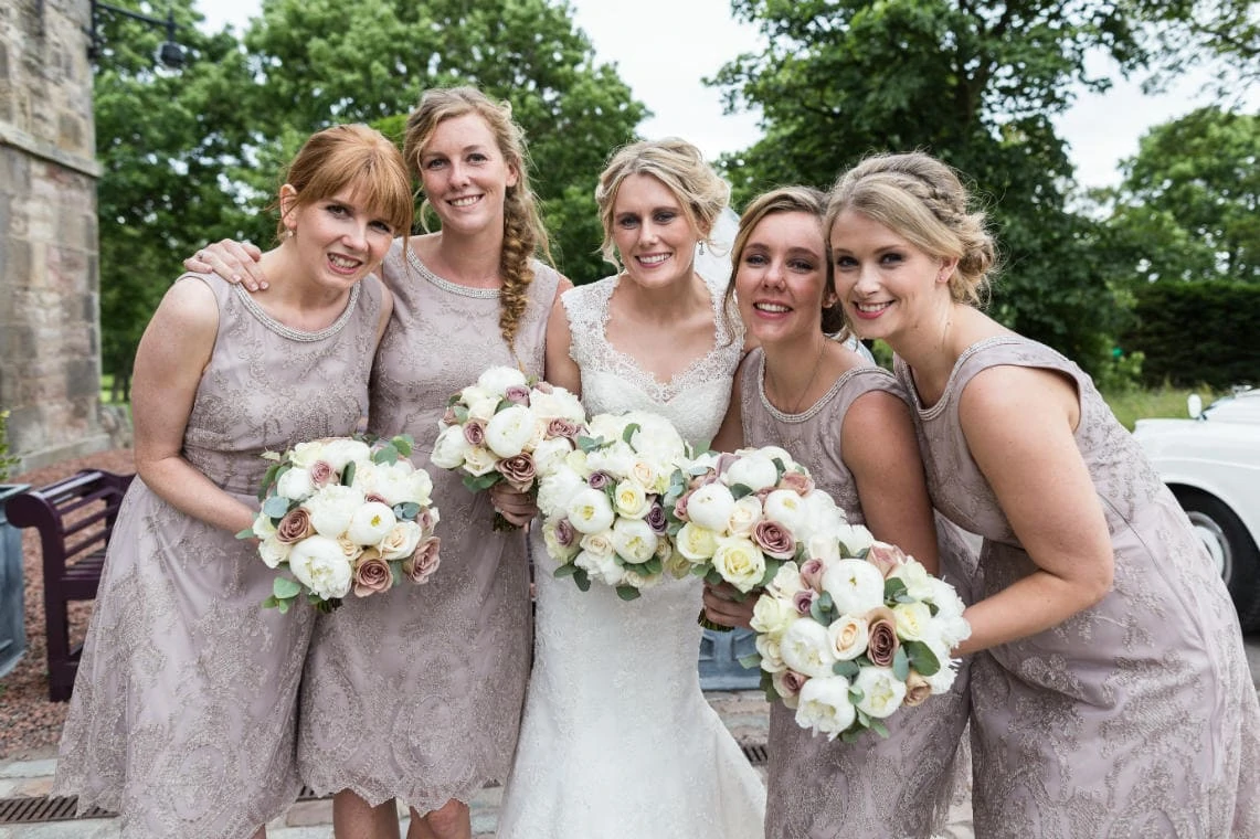 bride and bridesmaids outside the Stables Ballroom