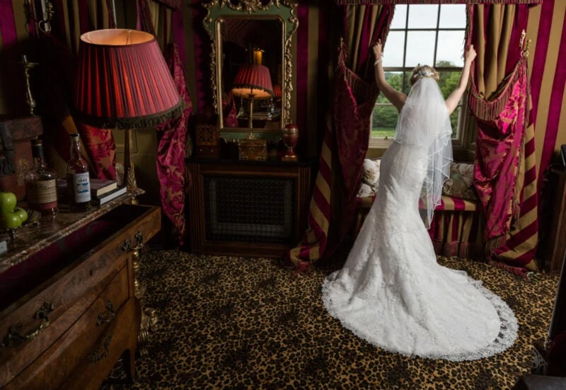 Prestonfield House wedding full-length bridal pose in front of the window in her bedroom suite