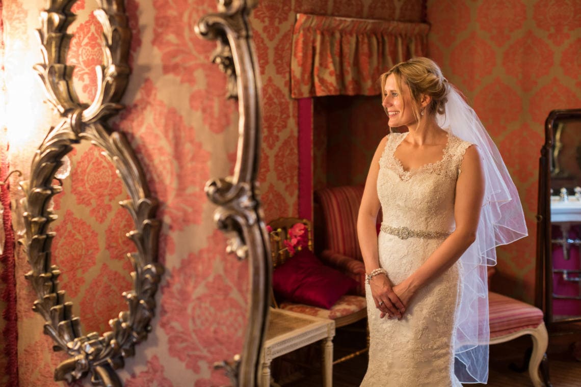 bride looking into a mirror
