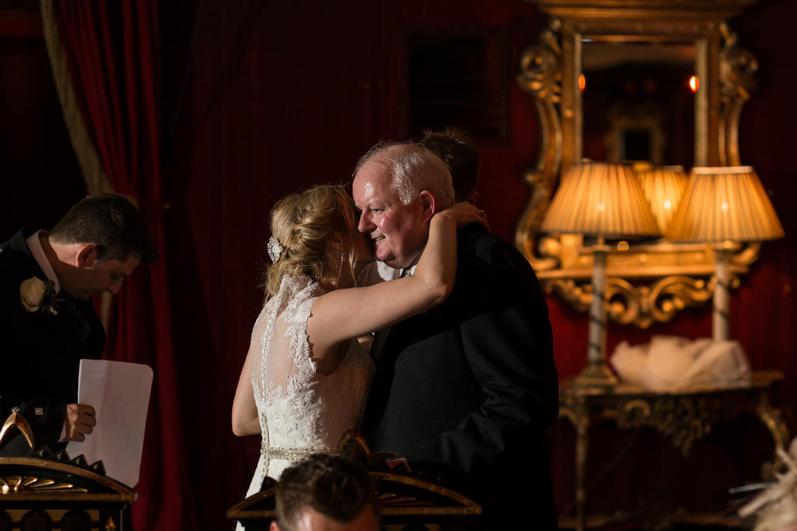 bride embraces her dad after his speech in the Stables Ballroom