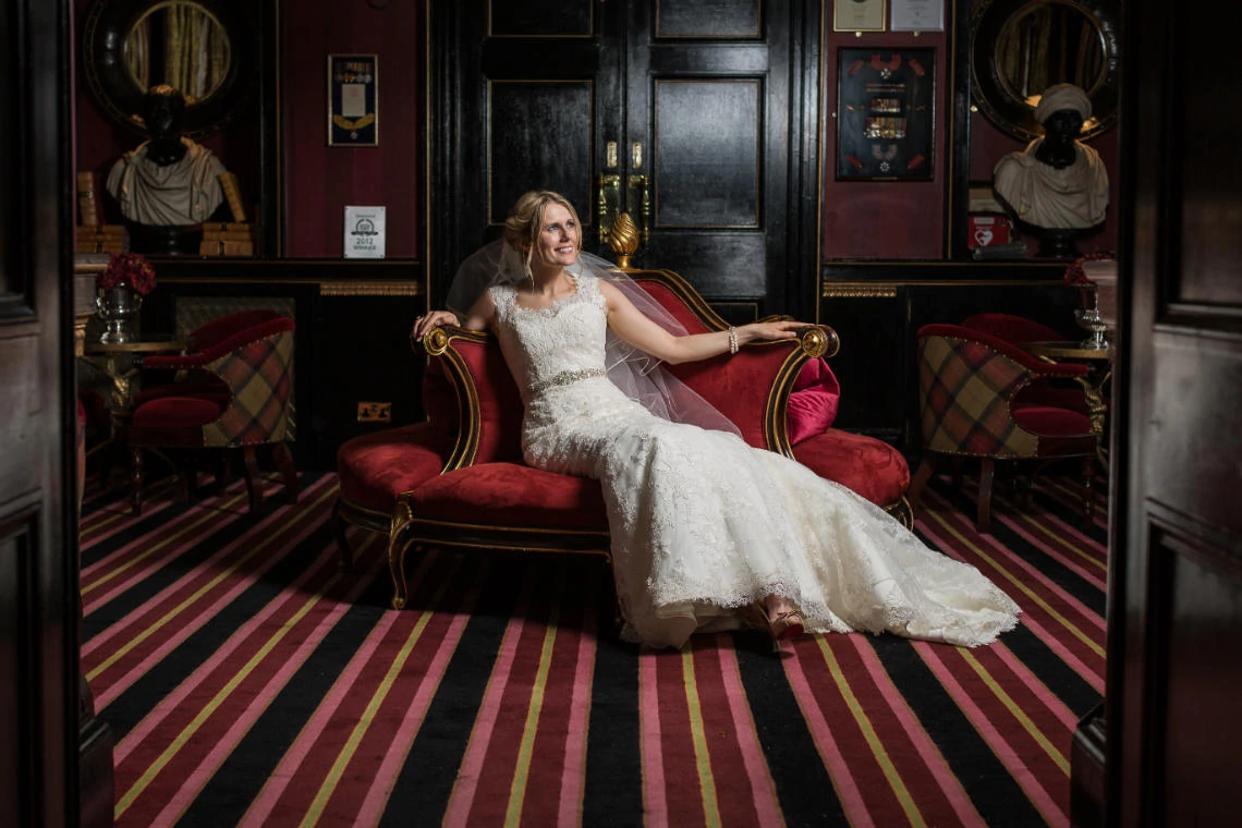 Reception bridal pose on chair