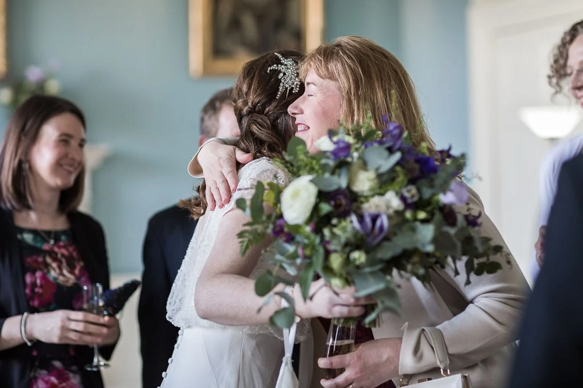 Royal College Of Physicians Edinburgh Wedding lady congratulating bride at drinks ceremony