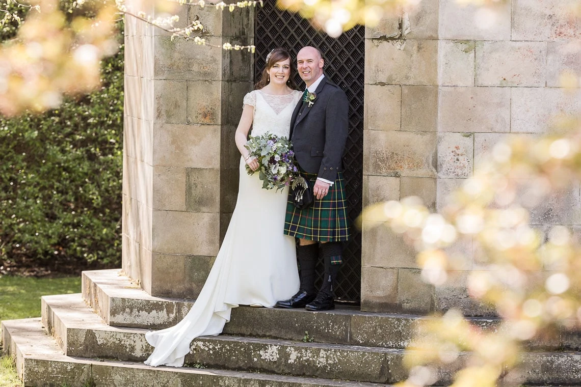 Royal College Of Physicians Edinburgh Wedding - posed photo of bride and groom in Queen's Street Gardens