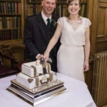 newlyweds cutting wedding cake