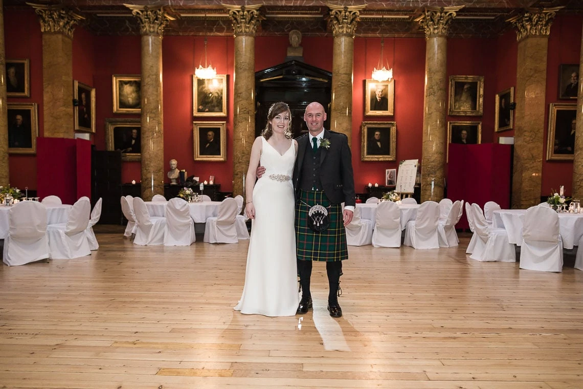 Newlyweds standing in the Great Hall