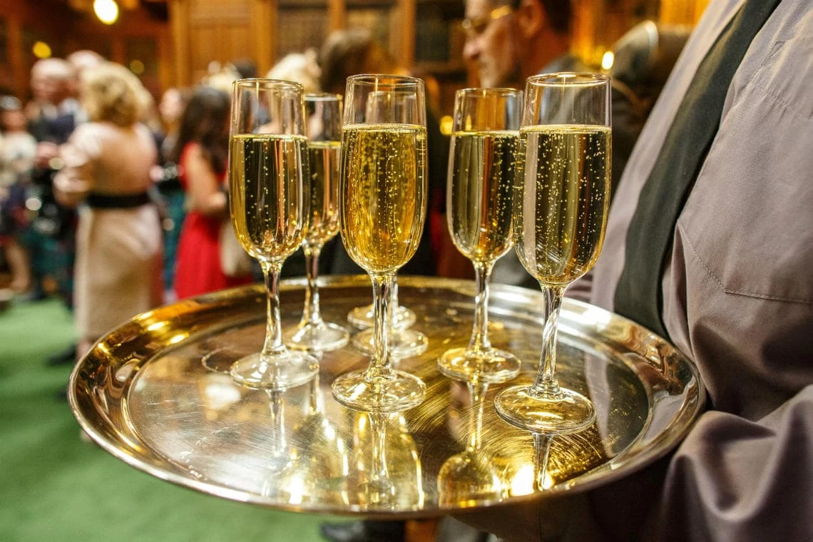 a tray of glasses filled with champagne