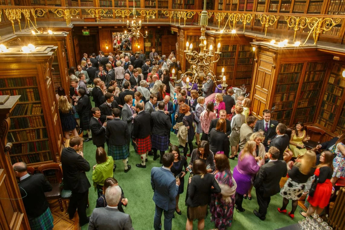 guests enjoying a champagne reception in the New Library