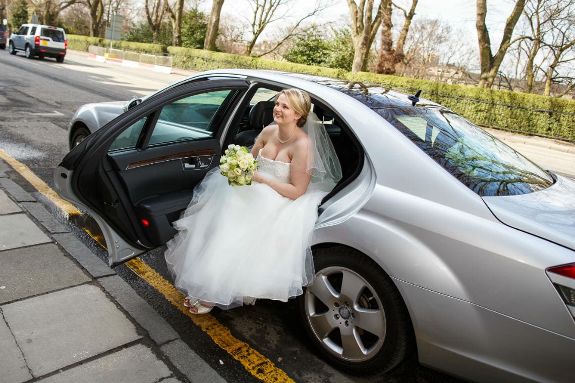 bride exiting wedding car outside RCPE