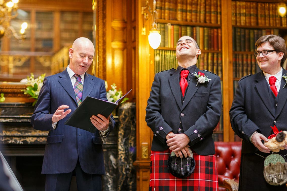 groom laughing during a Humanist ceremony in the New Library