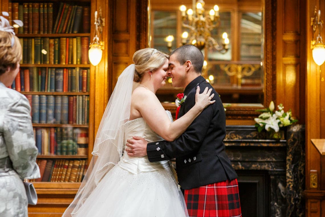 newlyweds embrace in the New Library