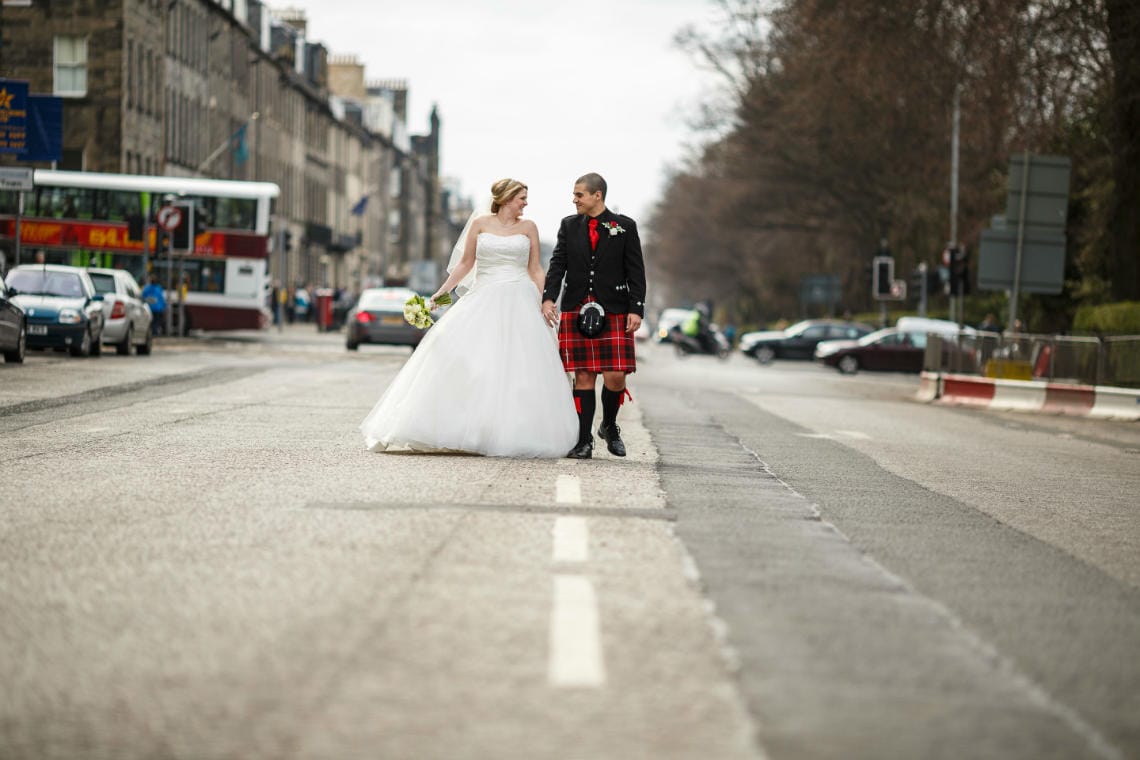 bride and groom walking along Queen Street in Edinburgh