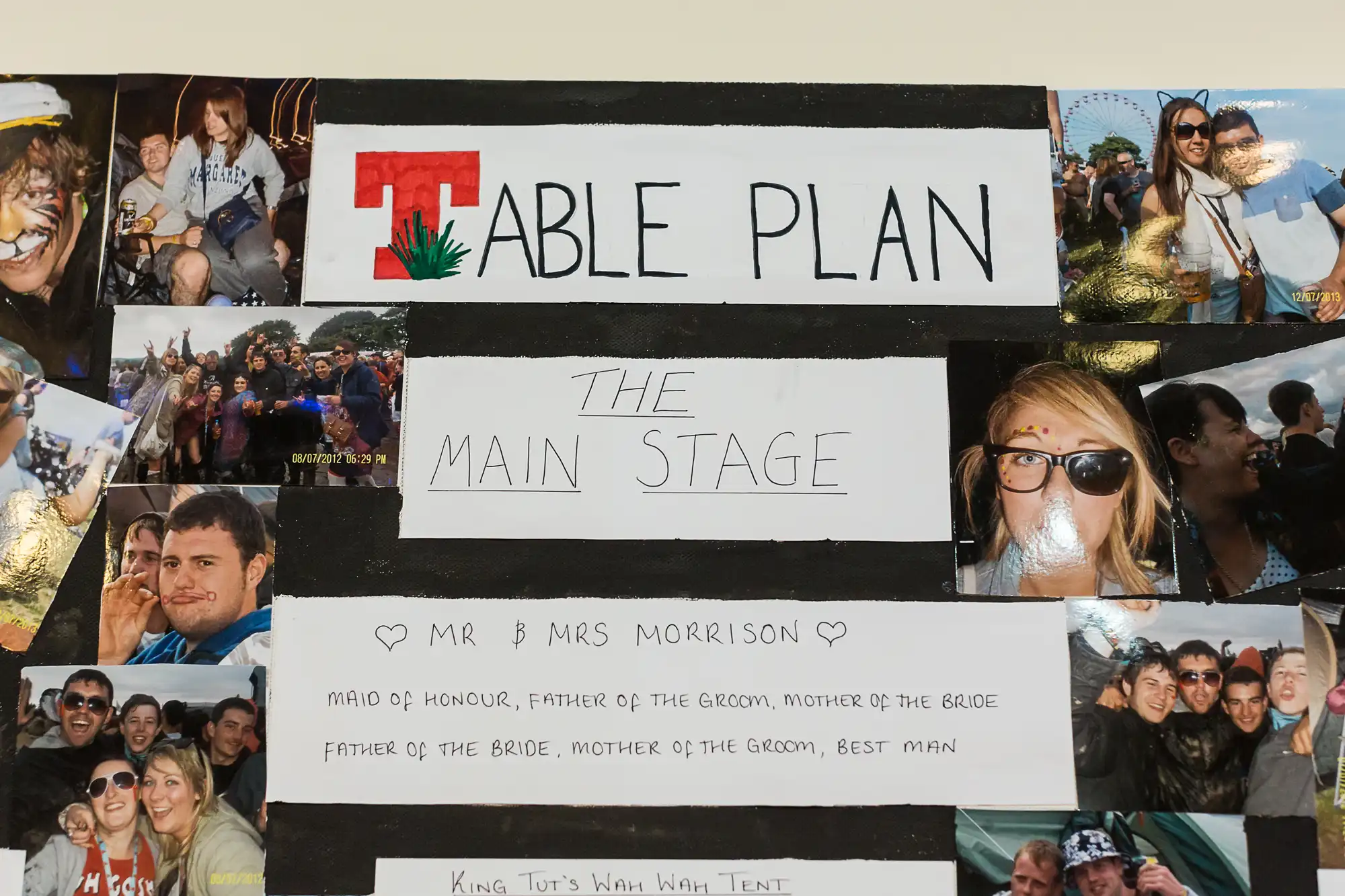 A bulletin board displaying a wedding seating chart titled "table plan," with photos of guests and labeled sections like "the main stage.