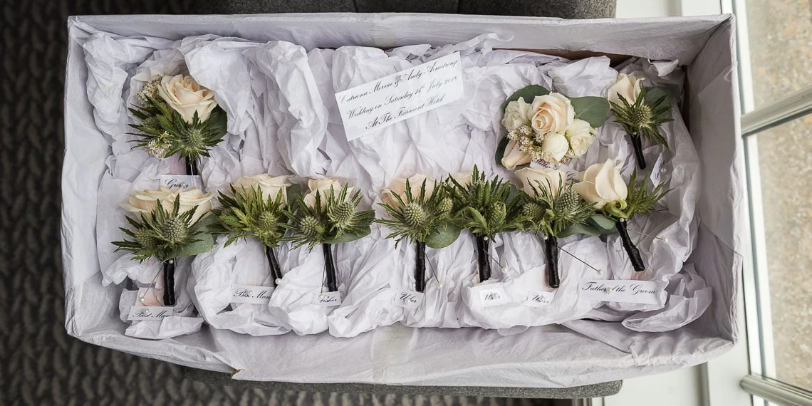 boy's buttonholes roses and thistles