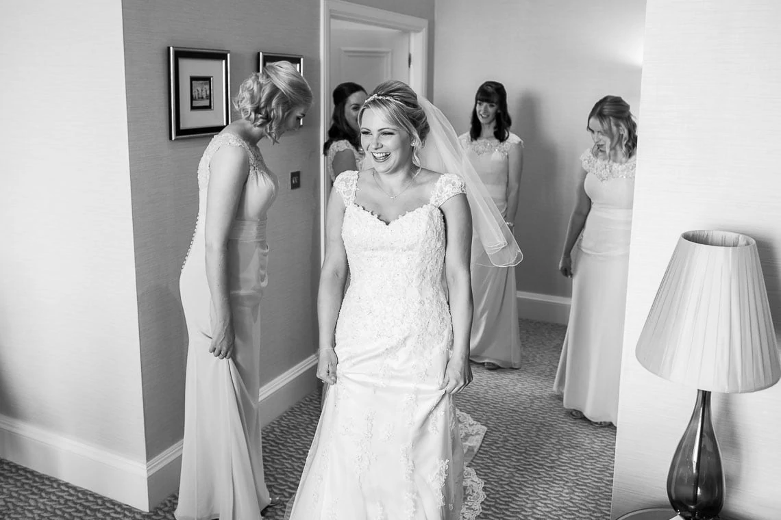 bridesmaids looking at bride