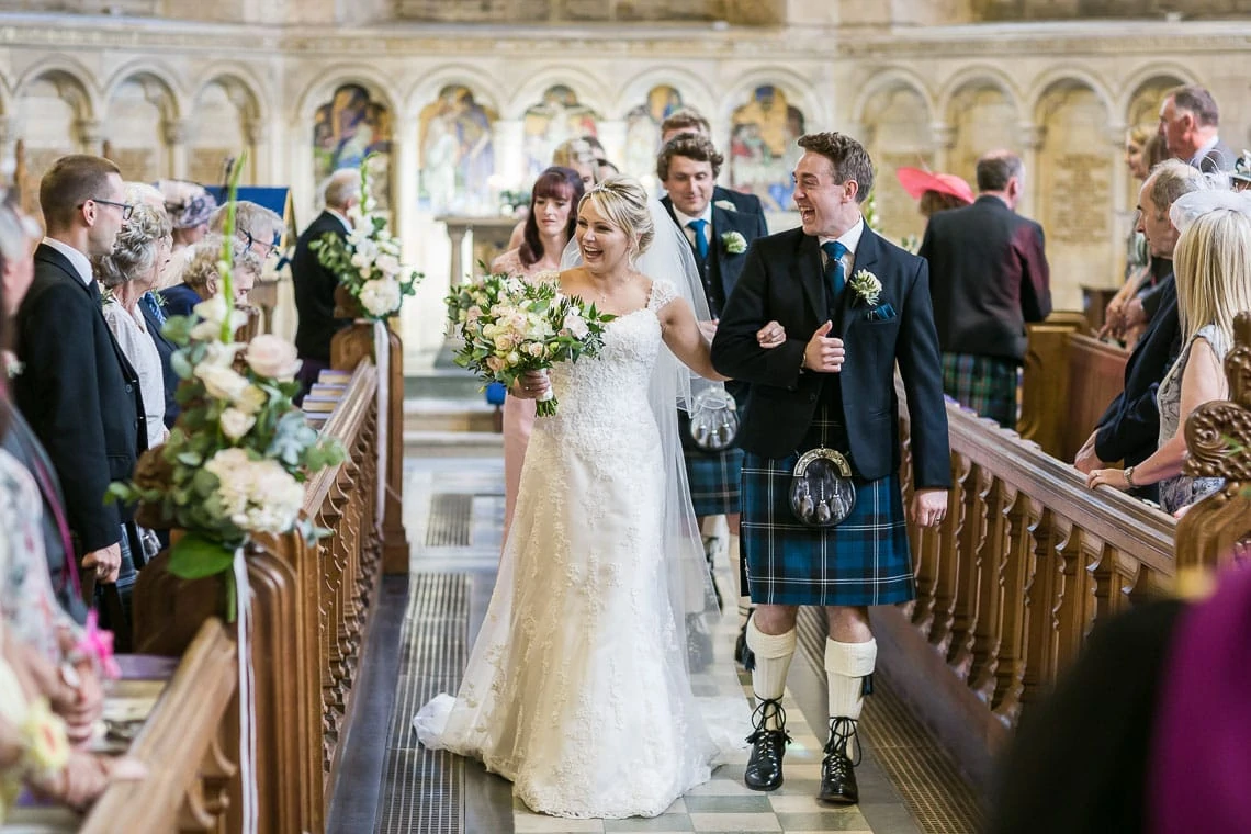 wedding recessional newlyweds walking up the aisle at St Salvator's Chapel