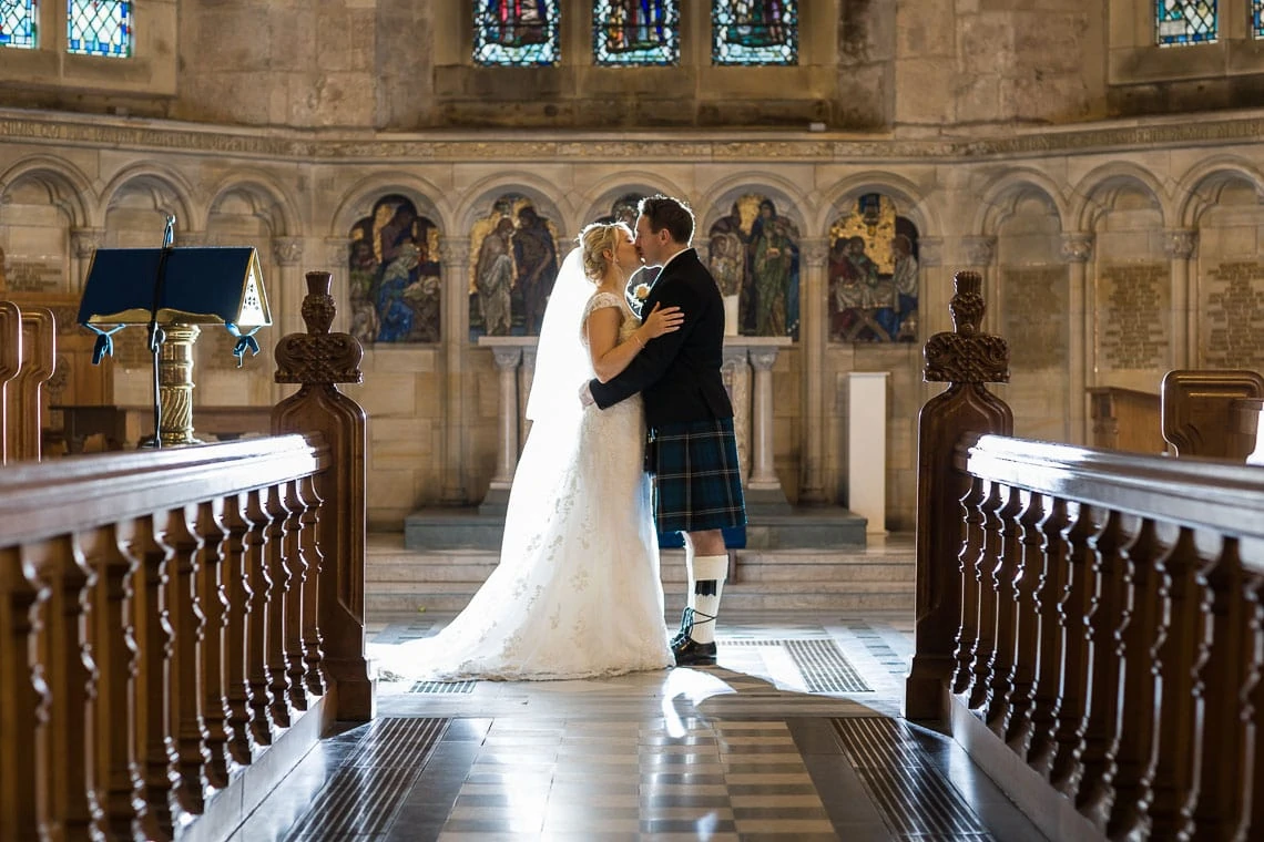 newlywed photo standing on the altar at St Salvator's Chapel