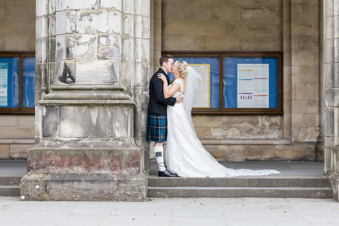 newlywed photo standing under the arches at St Salvator's Chapel