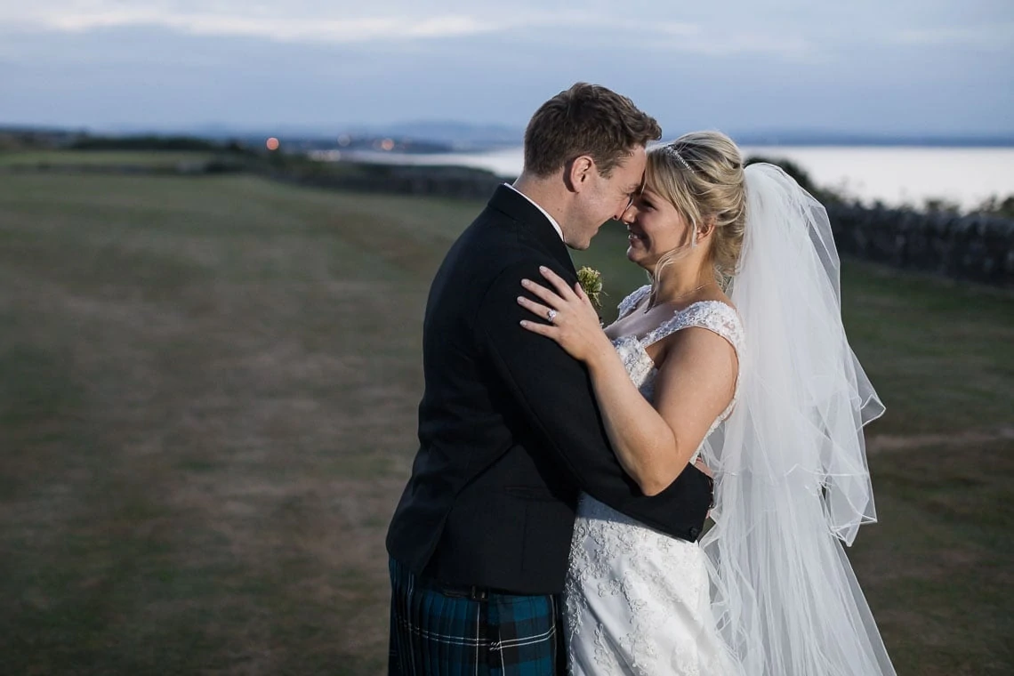 Fairmont St Andrews wedding newlyweds photo on the golf course at dusk