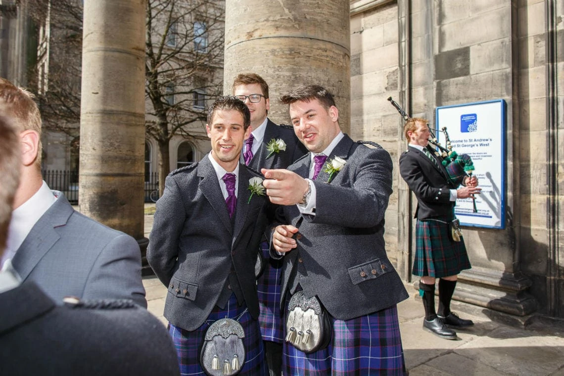 groomsmen outside St Andrew's and St George's West Church of Scotland