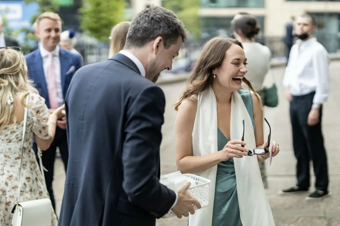 Guests laughing outside church