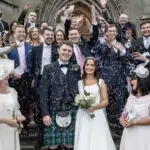 Group confetti photo outside St Mary's Cathedral Edinburgh