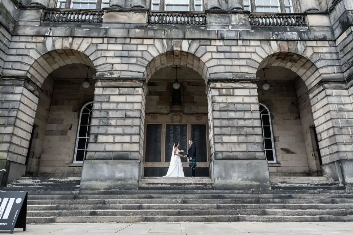Newlyweds in the arch of the Old College