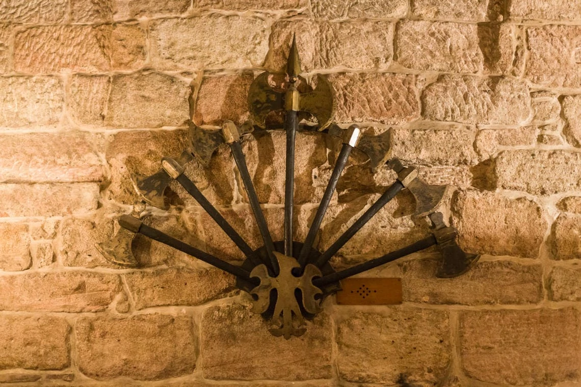The Dungeon Gateside - axe weapons on the wall