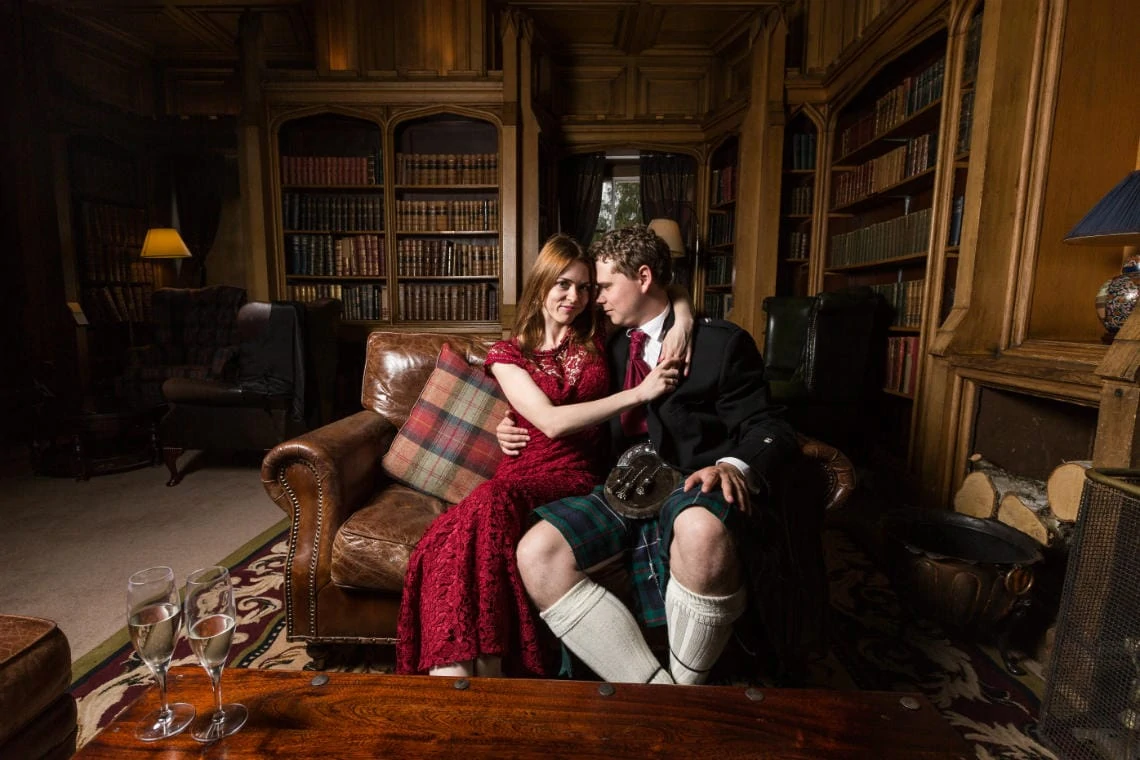 The Library - newlyweds embrace on the sofa