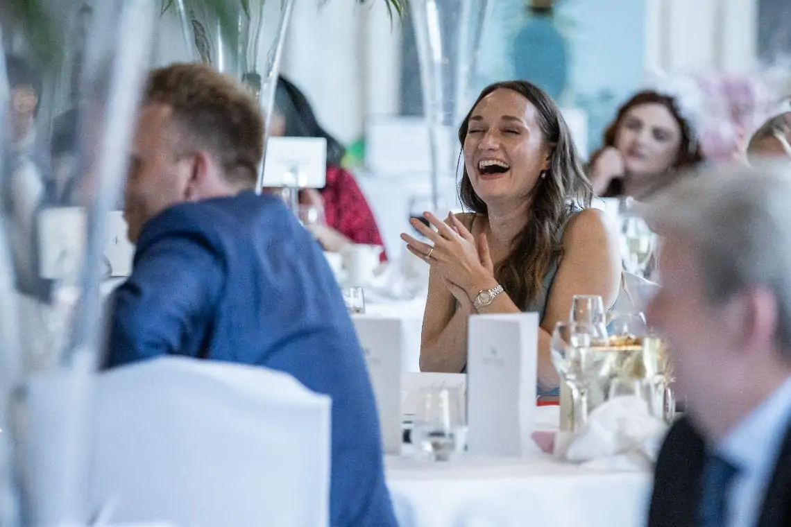 Guest laughing during speeches