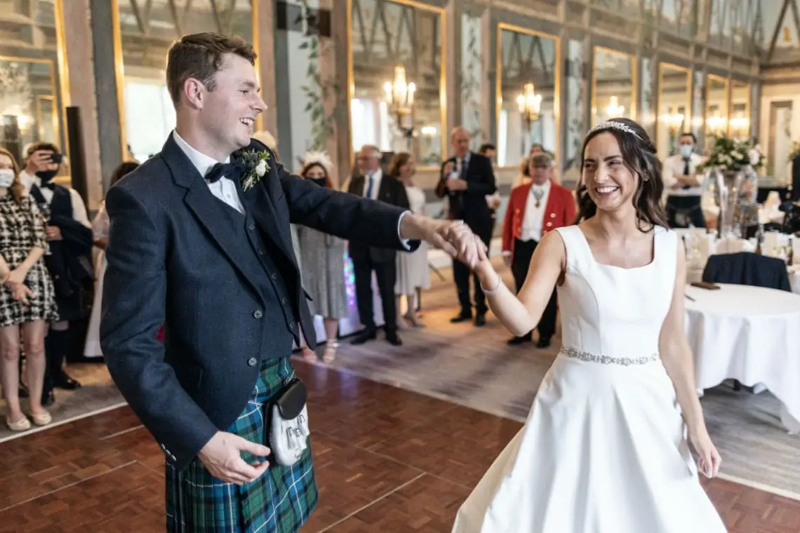 Bride and Groom perform their first dance on the dancefloor