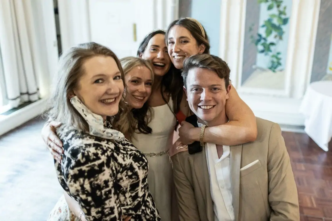 Bride with a group of friends at reception