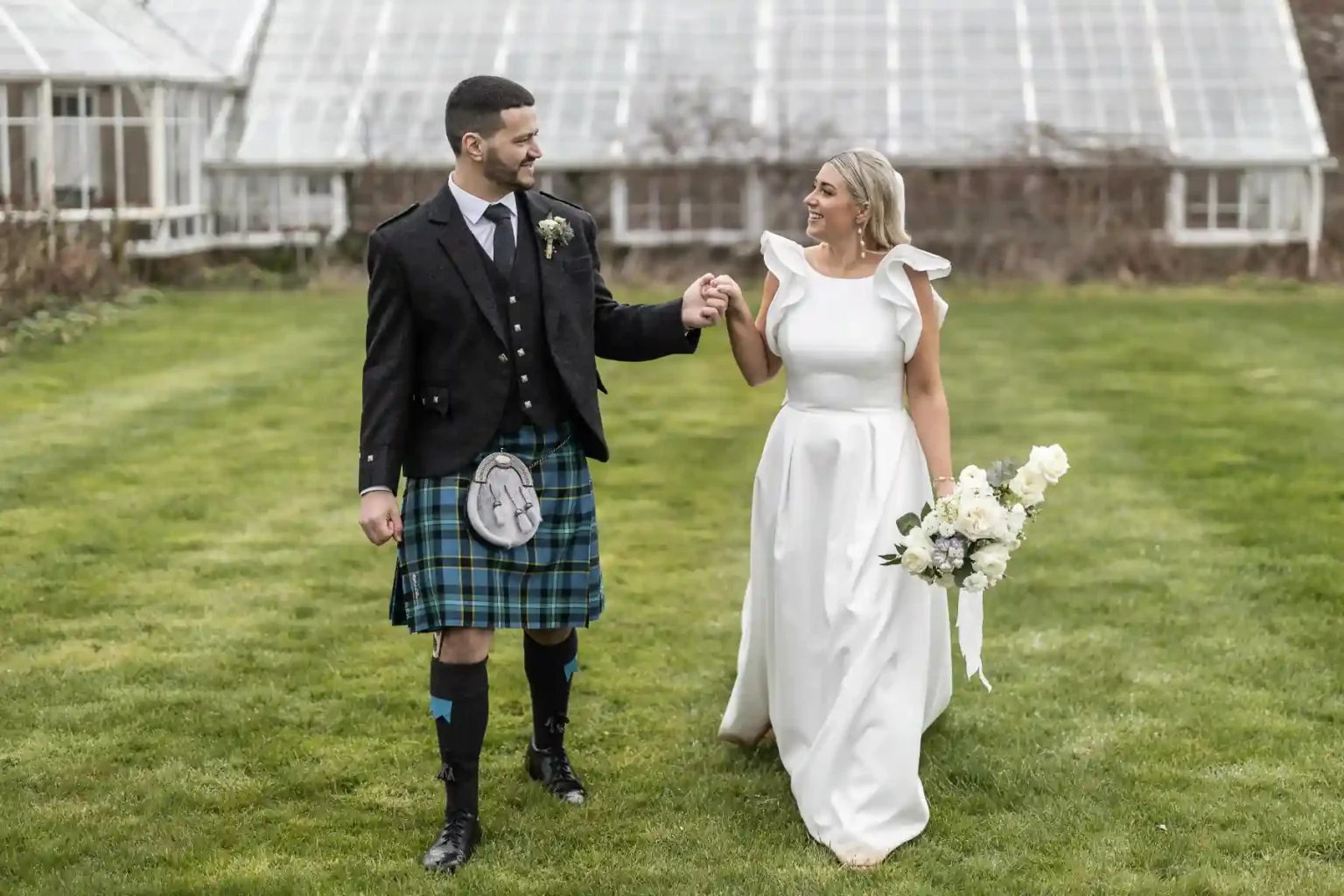 Walled Garden newlyweds walking