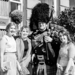 piper and female guests at the entrance to the George Hotel